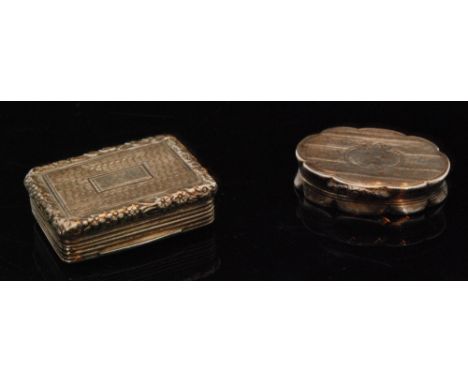 A William IV hallmarked silver oval vinaigrette with engine turned decoration to hinged cover, opening to foliate pierced gil