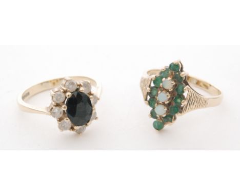 A 9ct hallmarked emerald and opal cluster ring, with a 9ct sapphire and paste cluster ring. (2)