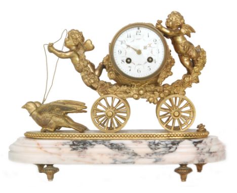 A 19th Century ormolu eight day strike mantle clock modelled as a carriage being pulled by two doves with twin cherubs in att