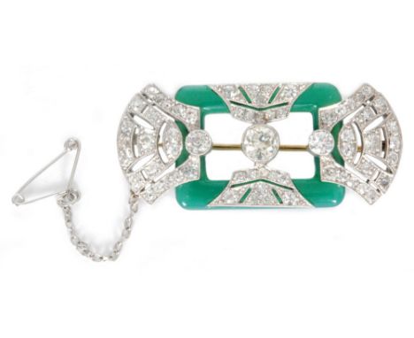 A platinum Art Deco diamond and jadite brooch, central millegrain set old cut diamond, weight approximately 0.75ct, flanked b