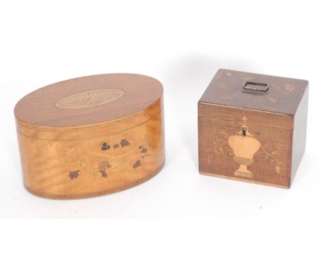 Amended description - An early 20th Century satinwood tea caddy of oval form in the Georgian style, inlaid with a bird amongs