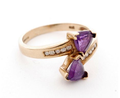 A modern 9ct hallmarked amethyst and diamond ring, diamond channel set shoulders each terminating in a single trillion cut, c