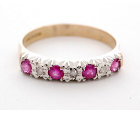 A 9ct hallmarked ruby and diamond half eternity ring seven alternating stones to a plain shank, ring size O 1/2. 