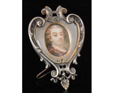 A late 18th to early 19th Century portrait miniature of a Georgian gentleman framed within a later French white metal frame, 