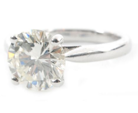 An 18ct diamond solitaire ring, brilliant cut four claw set stone weight 2.52ct, colour J/K, clarity SI1, all to knife edged 