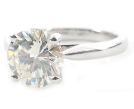 An 18ct diamond solitaire ring, brilliant cut four claw set stone weight 2.52ct, colour J/K, clarity SI1, all to knife edged 