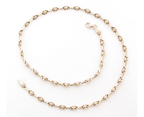 A 9ct hallmarked fancy link chain terminating in bolt ring fastener, length 44cm, weight 8.6g