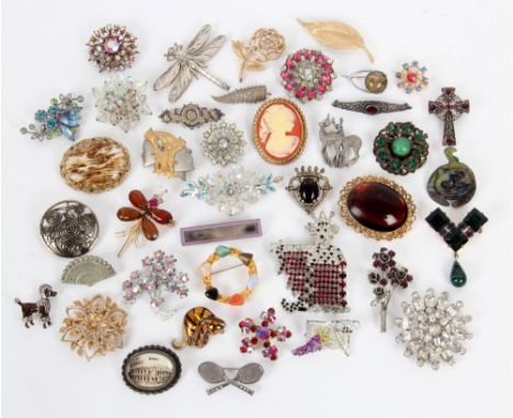 A collection of assorted 1930s and later vintage costume jewellery brooches to include Butler and Wilson tennis racket brooch