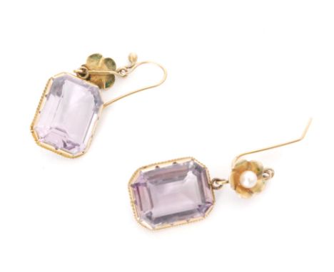 A pair of early 20th Century amethyst and pearl earrings, emerald cut amethysts below a single pearl set to a petal border, l