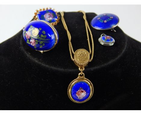 Small collection of silver and other metal enamel and ceramic pendants and brooches etc., includes an egg locket, (5)