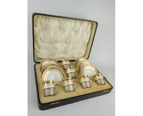 Boxed George V Aynsley porcelain coffee service with Adie Bros silver mounts, together with a later boxed Worcester coffee se