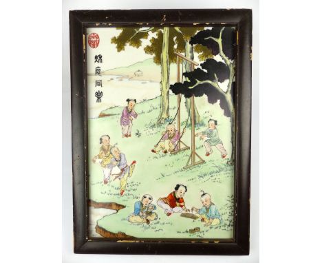 Chinese rectangular porcelain panel decorated with children playing, hardwood framed 