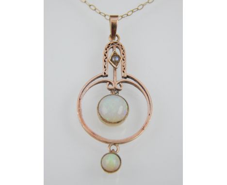 Art Nouveau 9ct yellow gold and opal pendant of open circular form, on fine link chain