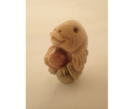 Hand carved antique fish with peach carved nut Oriental Netsuke with signature