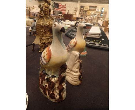 Pair of Staffordshire mantel ornaments in the form of birds perched on rocks H: 25 cm 