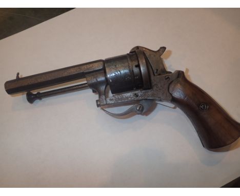 Small antique pinfire revolver with folding trigger