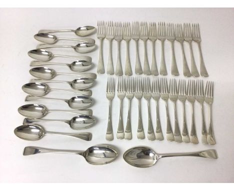 Quantity of silver flatware, including twenty-four matching forks (twelve dessert and twelve dinner), twelve dessert spoons, 