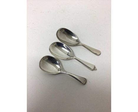 Three silver caddy spoons, various hallmarks