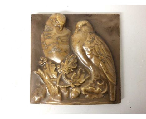 Unusual 1920s ceramic plaque with relief moulded decoration depicting two birds