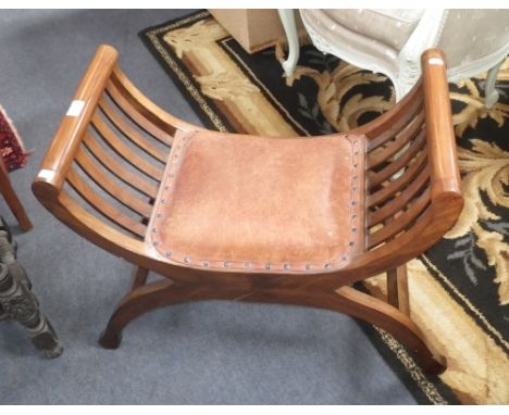An 'X'- frame stool with leather seat 