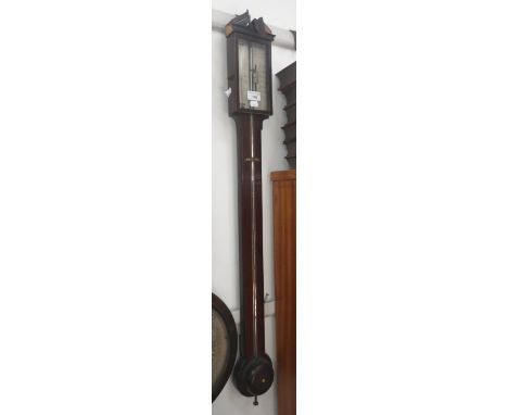 A Regency mahogany stick barometer, the silver scale signed 'C Carabelli'