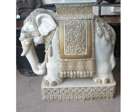 A glazed ceramic garden seat in the form of an elephant