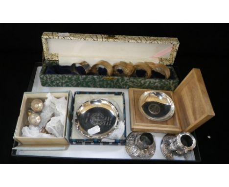 A set of Asian sterling silver menu card holders, a cased set of five silver napkin ring holders and other Asian white metal 