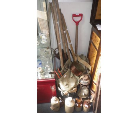 A collection of vintage garden tools, a copper saucepan and sundry items
