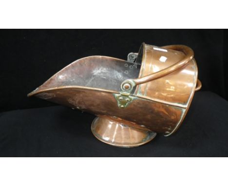 A 19th century copper helmet coal scuttle and a pine stool 