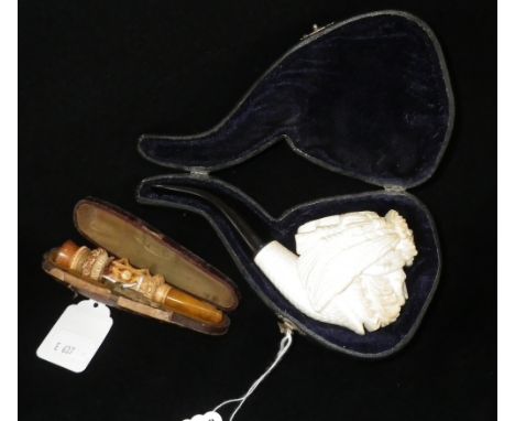 A Victorian style clay pipe and one other Meerschaum cheroot holder with amber mouthpiece (2)