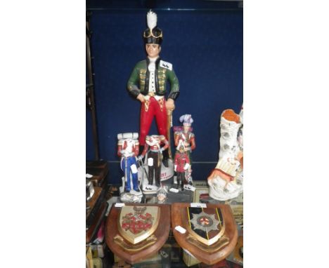 A ceramic advertising figure of an Irish soldier, circa 1750 inscribed 'Irish Mist, Ireland's Legendary Liquor', a collection