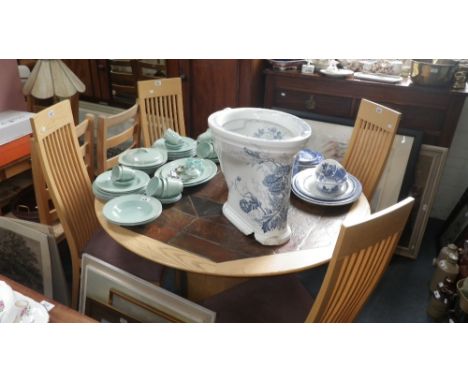 A set of four contemporary ash high backed dining chairs and a matching tile top and ash circular dining table 