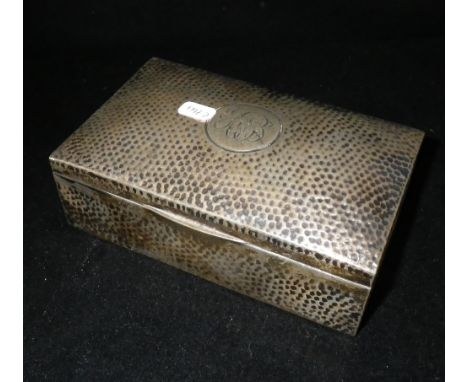 A planished silver cigarette case with cedar lining