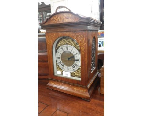 A late Victorian rosewood cased mantel clock with marquetry inlay, the brass dial with silvered chapter ring (pendulum and ke