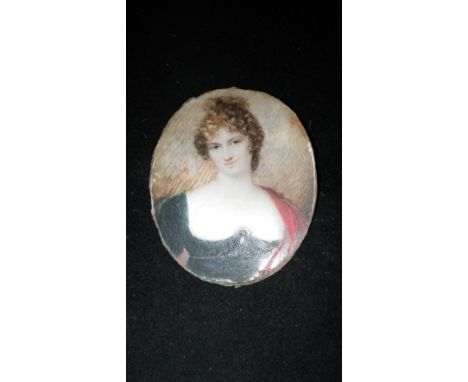 A 19th century painted portrait miniature on ivory, a young lady wearing jewellery