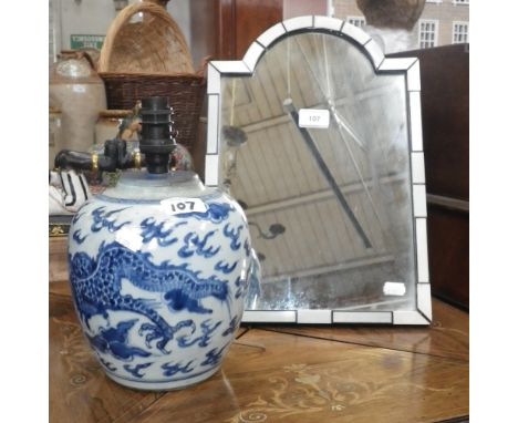 An easel mirror with ivory and ebonised frame and an oriental blue and white ginger jar converted to a table lamp