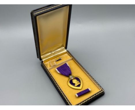 WWII U.S army Purple Heart medal in original box (includes button &amp; ribbon sections)