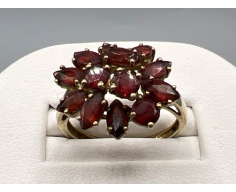 Ladies 9ct gold Garnet cluster ring. Comprising of 10 marquee cuts and 3 round cuts. 3.7g size R