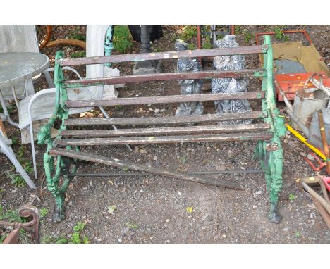 A VICTORIAN COALBROOKDALE STYLE CAST IRON GARDEN BENCH with foliate detail to arms terminating with dogs head ends and serpen