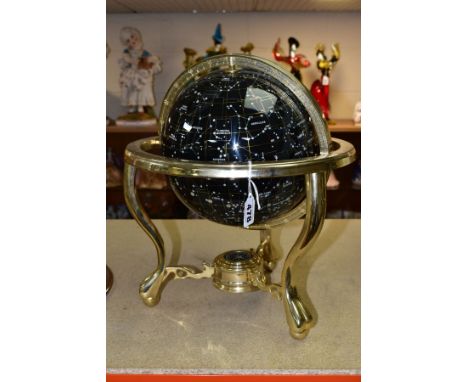 A BOXED GUILDFORD ASTRONOMICAL SOCIETY CELESTIAL GLOBE, supported by a brass metal stand inset with a compass, hologram authe