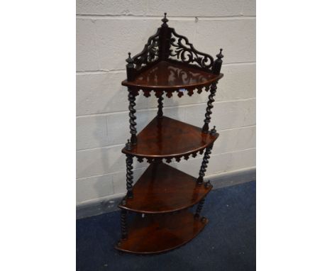 A VICTORIAN ROSEWOOD FOUR TIER WHAT NOT, raised pierced back, barley twist supports, finials and apron to each shelf, width 6