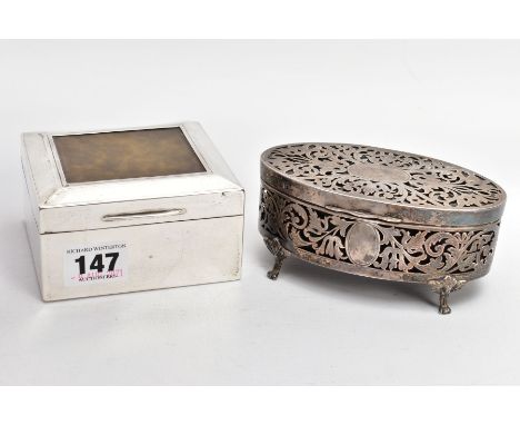 A GEORGE V SILVER LINED, SQUARE CIGARETTE BOX AND A PIERCED OVAL VANITY BOX, engine turned design set with a square material 