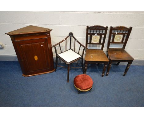 A PAIR OF EDWARDIAN OAK CHAIRS, with spindles below arched top rail, square ceramic panel to splat, on turned front legs toge