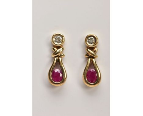 A PAIR OF 9CT GOLD RUBY AND DIAMOND EARRINGS, each drop set with an illusion set single cut diamond, with a cross and openwor