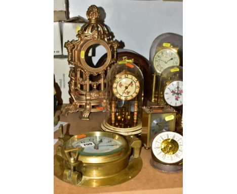 A GROUP OF EIGHT CLOCKS AND A REPRODUCTION GILT BRASS MANTEL CLOCK CASE, including three anniversary clocks, tallest 30cm, an