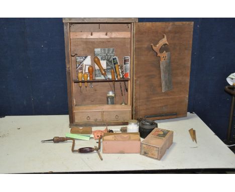 A VINTAGE WOODEN TOOL CUPBOARD containing hand tools including a boxed  BB Planes wooden block plane by William Marples, chis