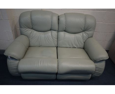 A PALE GREEN LA-Z-BOY MANUAL RECLINING SOFA, inner length 110cm x length 162cm