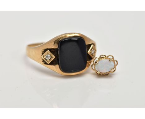 A GENTS 9CT GOLD SIGNET RING, centring on a curved rectangular onyx panel, flanked with circular cut cubic zirconia, plain po