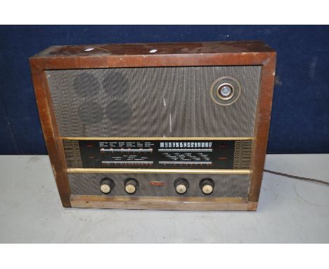 A VINTAGE MURPHY VALVE RADIO TYPE A242 RECEIVER in a Walnut case ( PAT pass, powers up but no audio output)