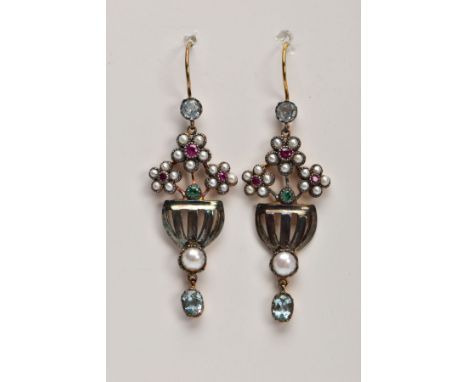 A PAIR OF YELLOW METAL GEM SET DROP EARRINGS, each designed with three flowers set with central rubies in a surround of split